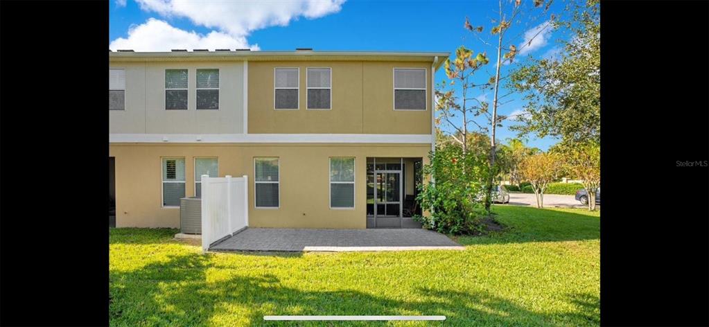 8174 Enchantment Drive, Unit 1601 Windermere, FL 34786 - Photo 18 of 21 a front view of a house with a yard