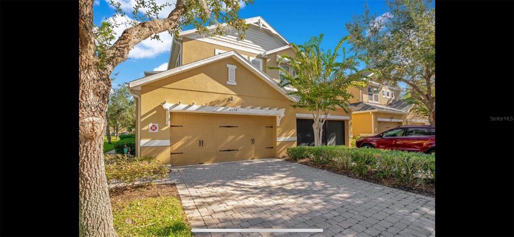 8174 Enchantment Drive, Unit 1601 Windermere, FL 34786 - Photo 2 of 21 a view of a house with a yard
