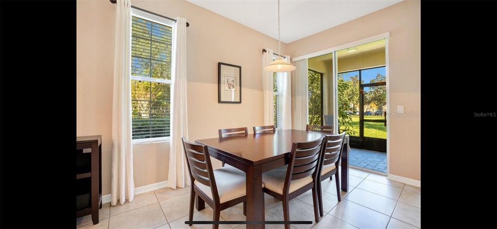 8174 Enchantment Drive, Unit 1601 Windermere, FL 34786 - Photo 7 of 21 a dining room with furniture and window