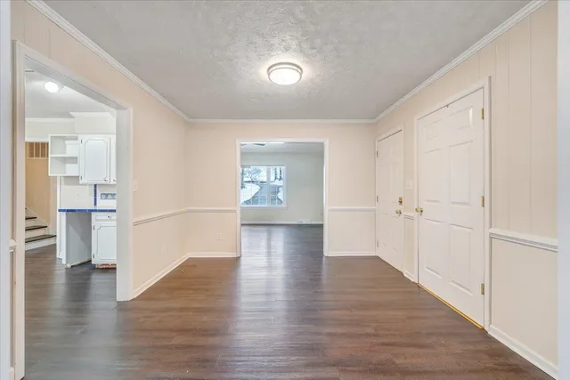 a view of an entryway door with wooden floor