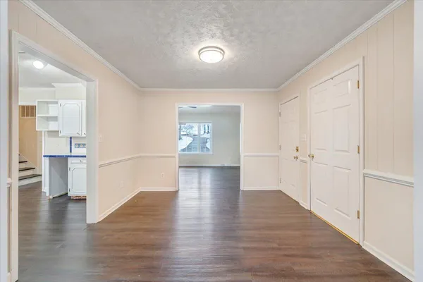 a view of an entryway door with wooden floor