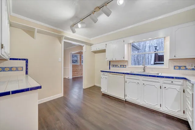 a bedroom with a bed and a ceiling fan