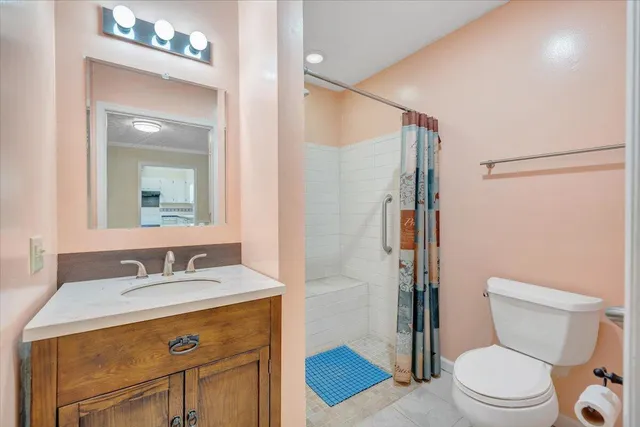 a view of a kitchen with wooden floor and windows