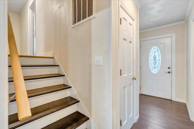 a view of kitchen with wooden floor and electronic appliances