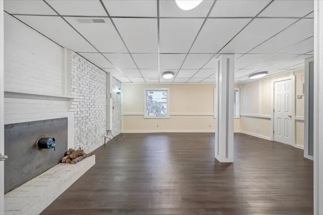 a view of a house with a snow in the yard
