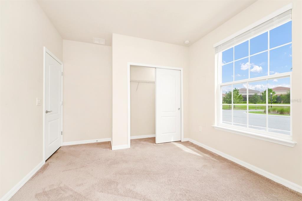 7513 Oak Spring Lane Davenport, FL 33837 - Photo 11 of 40 a view of an empty room with a window