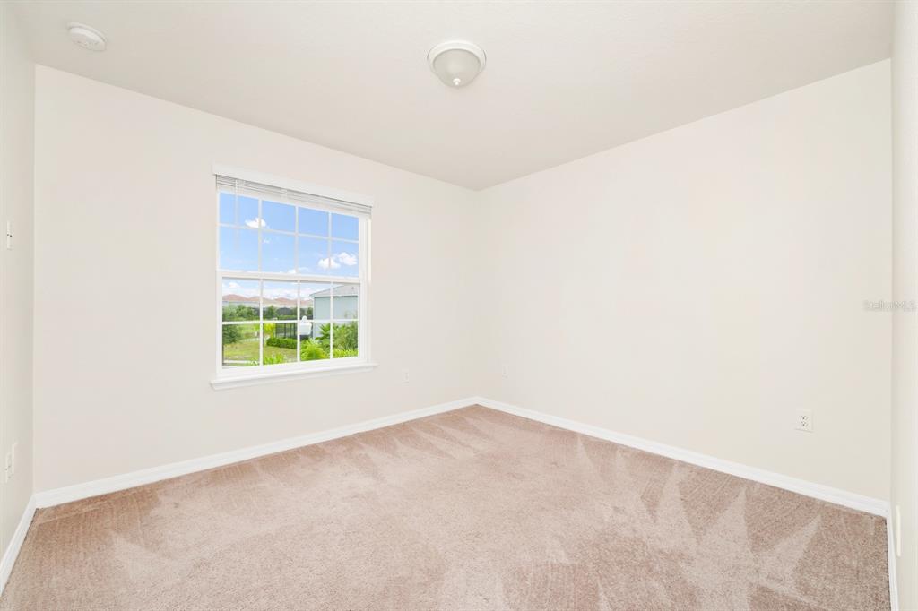 7513 Oak Spring Lane Davenport, FL 33837 - Photo 14 of 40 an empty room with a window