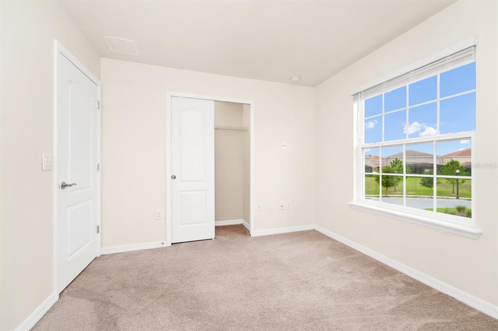 7513 Oak Spring Lane Davenport, FL 33837 - Photo 15 of 40 a view of an empty room with a window