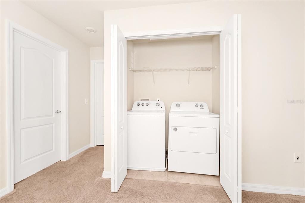 7513 Oak Spring Lane Davenport, FL 33837 - Photo 19 of 40 a utility room with dryer and washer
