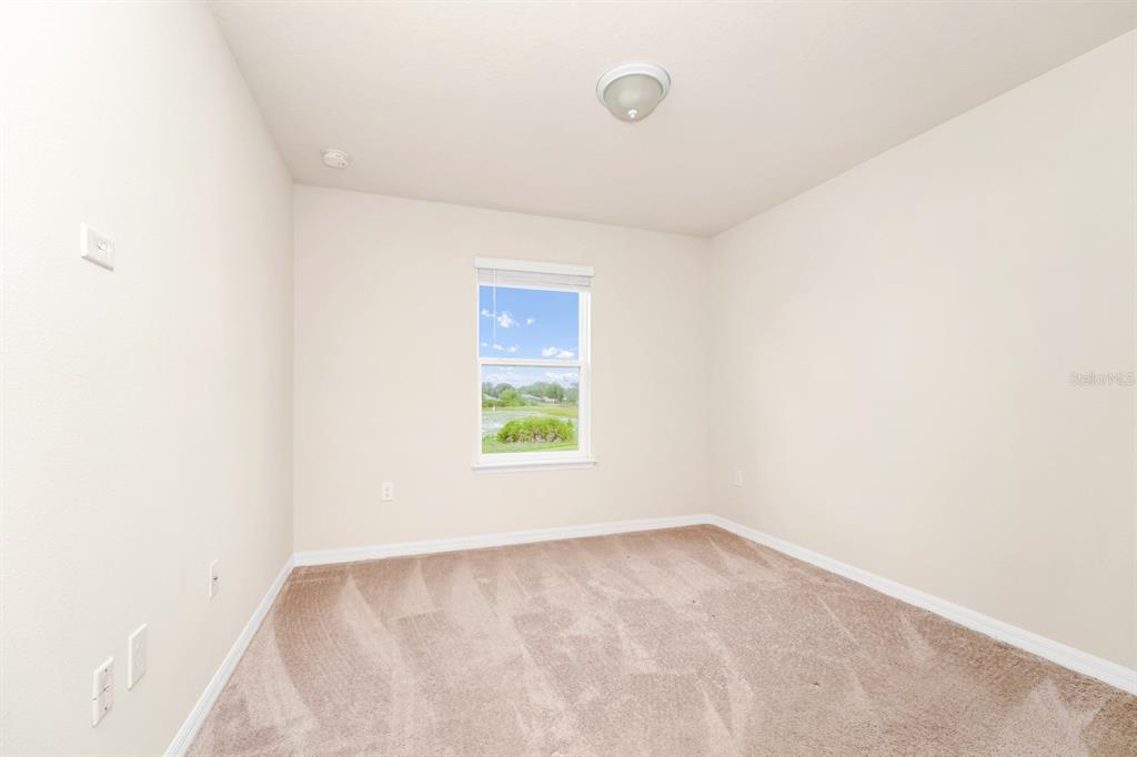 7513 Oak Spring Lane Davenport, FL 33837 - Photo 20 of 40 a view of an empty room with a window