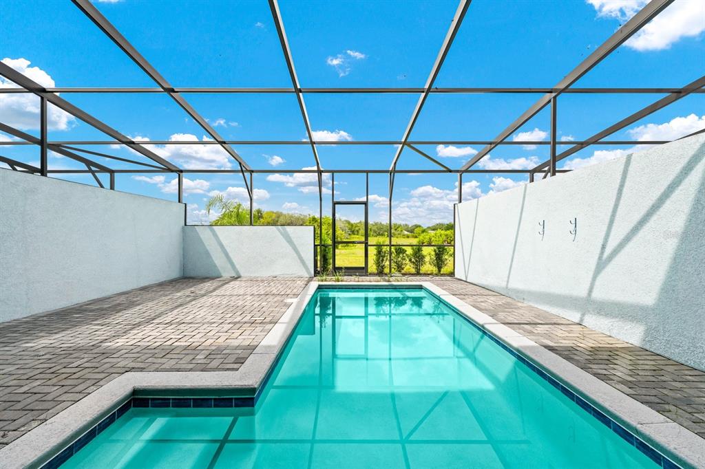 7513 Oak Spring Lane Davenport, FL 33837 - Photo 2 of 40 a view of a backyard with swimming pool