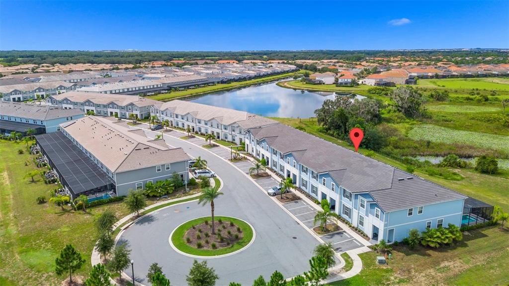 7513 Oak Spring Lane Davenport, FL 33837 - Photo 29 of 40 an aerial view of a city and lake view