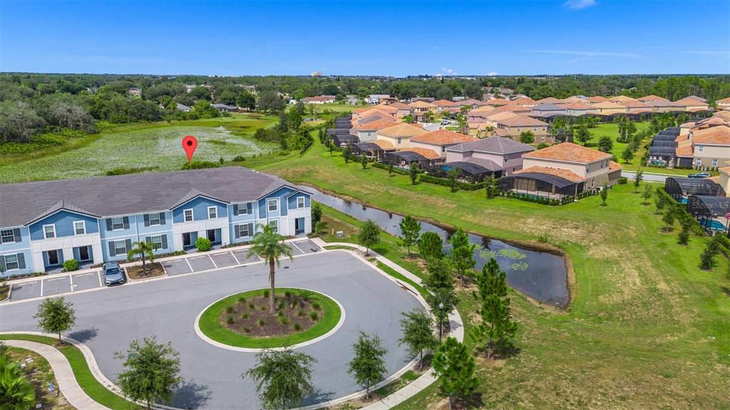 7513 Oak Spring Lane Davenport, FL 33837 - Photo 30 of 40 a view of a lake with a swimming pool