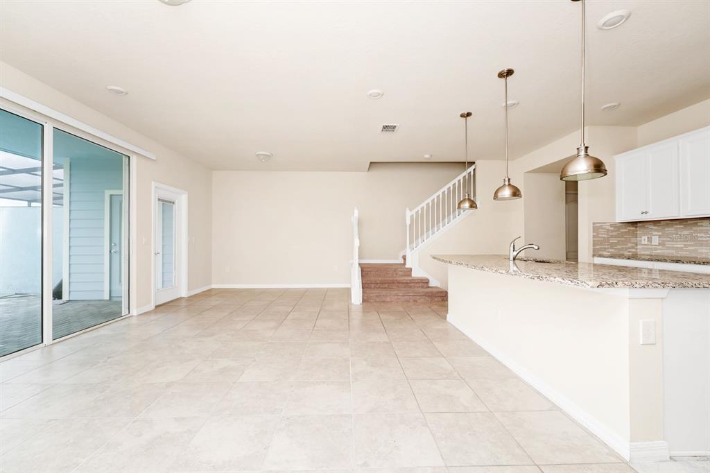 7513 Oak Spring Lane Davenport, FL 33837 - Photo 4 of 40 a view of a kitchen with a sink and window