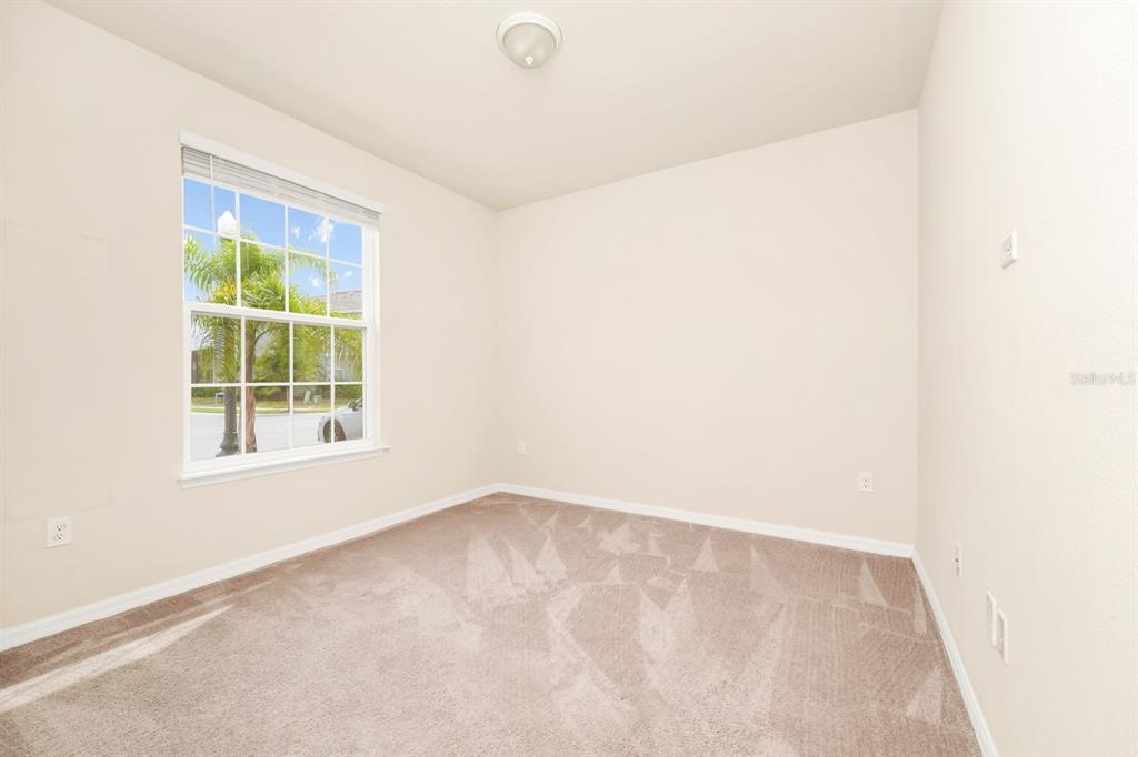 7513 Oak Spring Lane Davenport, FL 33837 - Photo 10 of 40 an empty room with a window