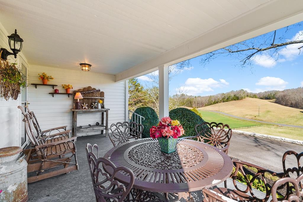 933 Millican Grove Road Sevierville, TN 37876 - Photo 33 of 54 a view of a dining room with furniture window and outside view