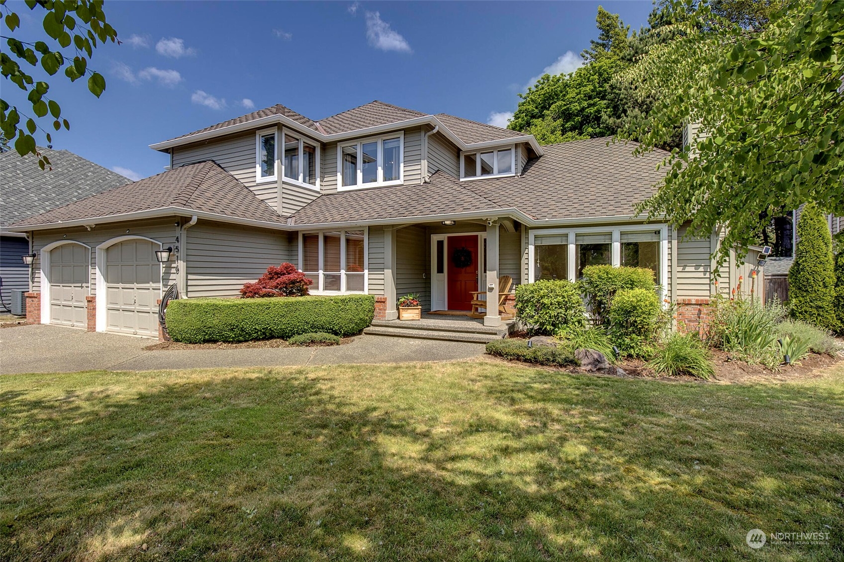 4516 Northeast 26th Court Renton, WA 98059 - Photo 1 of 28 a front view of a house with a yard