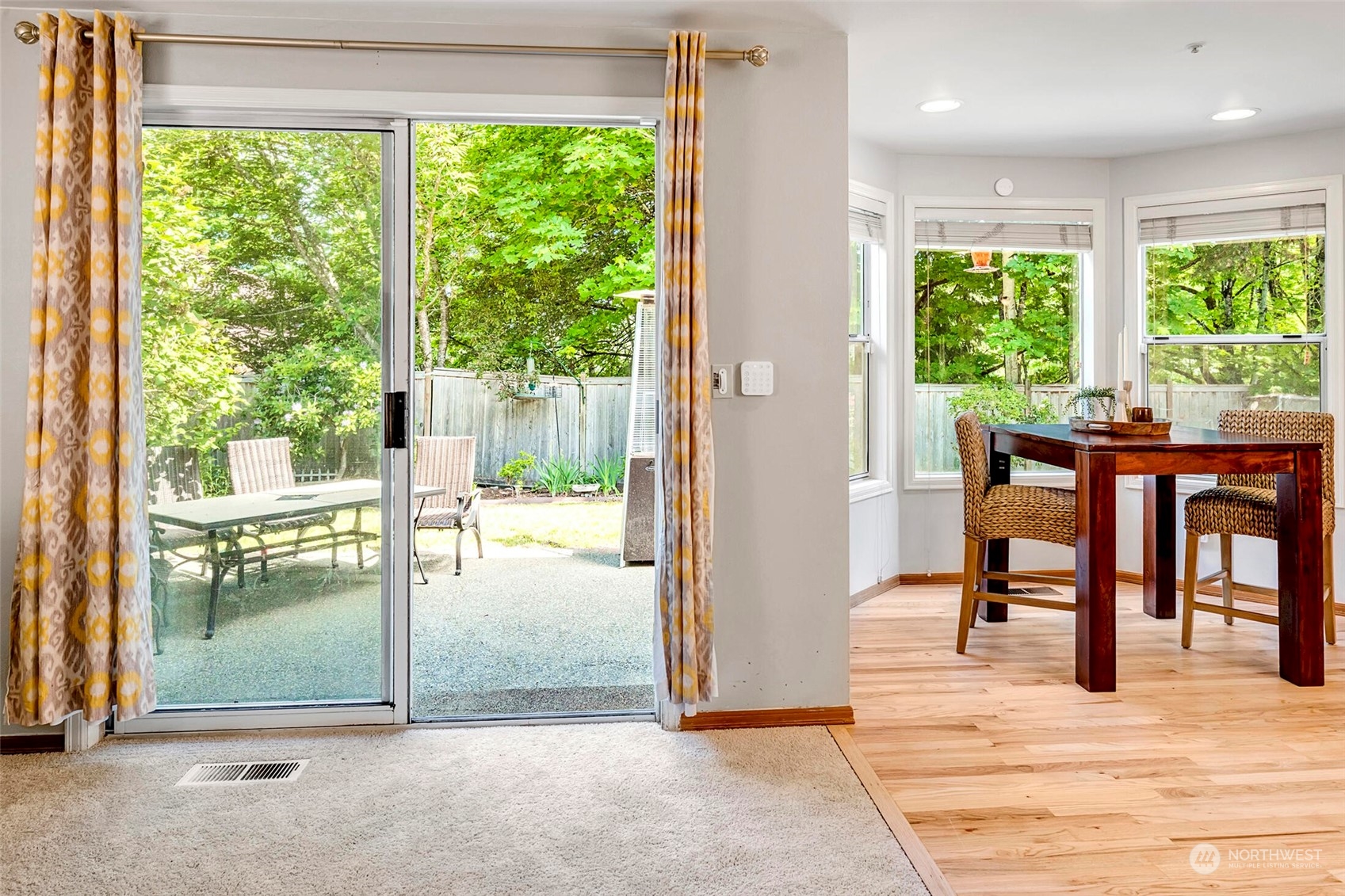 4516 Northeast 26th Court Renton, WA 98059 - Photo 11 of 28 a dining room with a glass table and windows