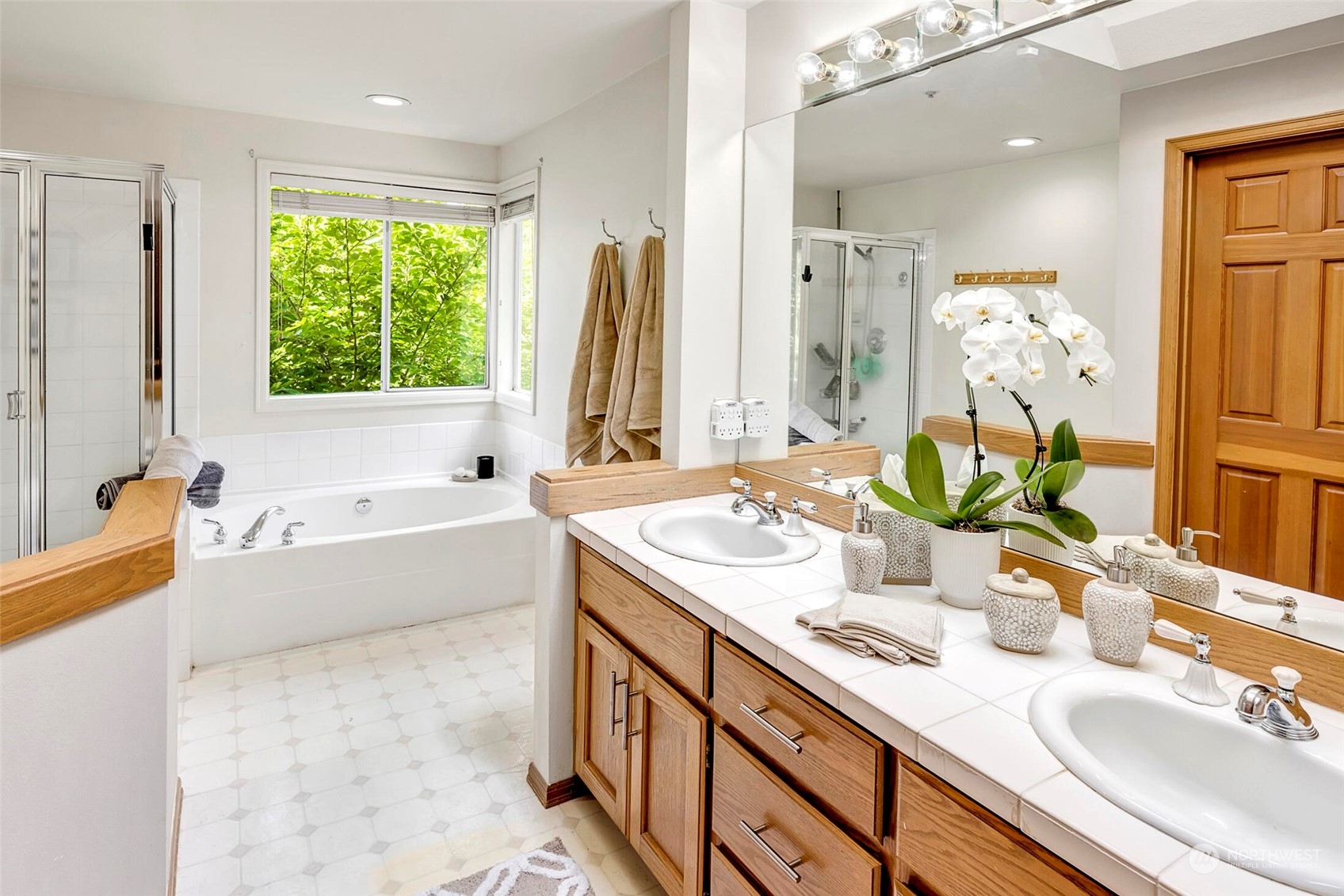 4516 Northeast 26th Court Renton, WA 98059 - Photo 17 of 28 a bathroom with a tub sink and mirror