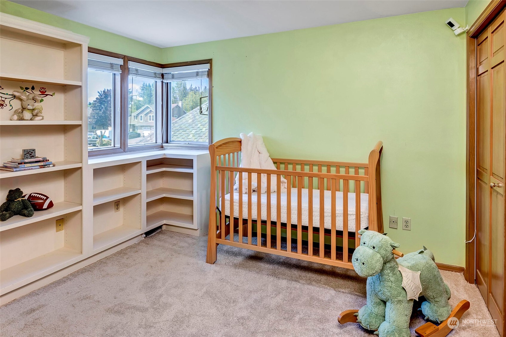 4516 Northeast 26th Court Renton, WA 98059 - Photo 18 of 28 a view of a bedroom with baby crib and toys