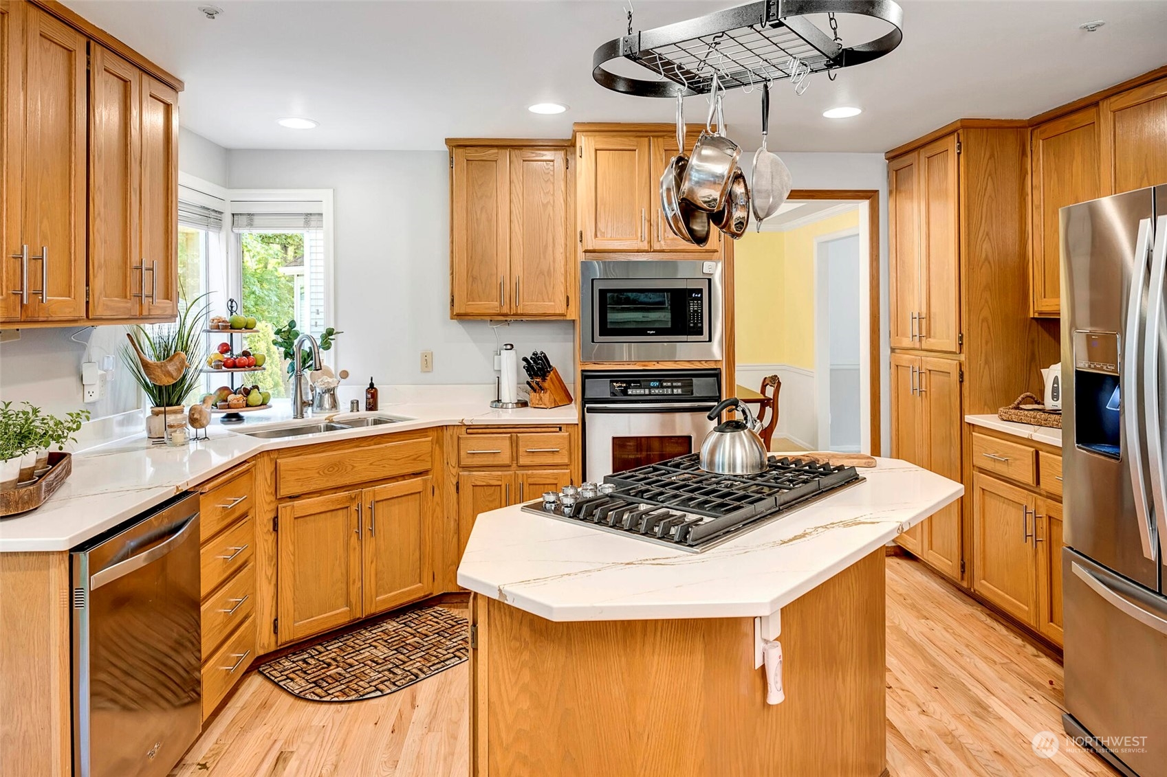 4516 Northeast 26th Court Renton, WA 98059 - Photo 7 of 28 a kitchen with stainless steel appliances granite countertop a sink stove and refrigerator