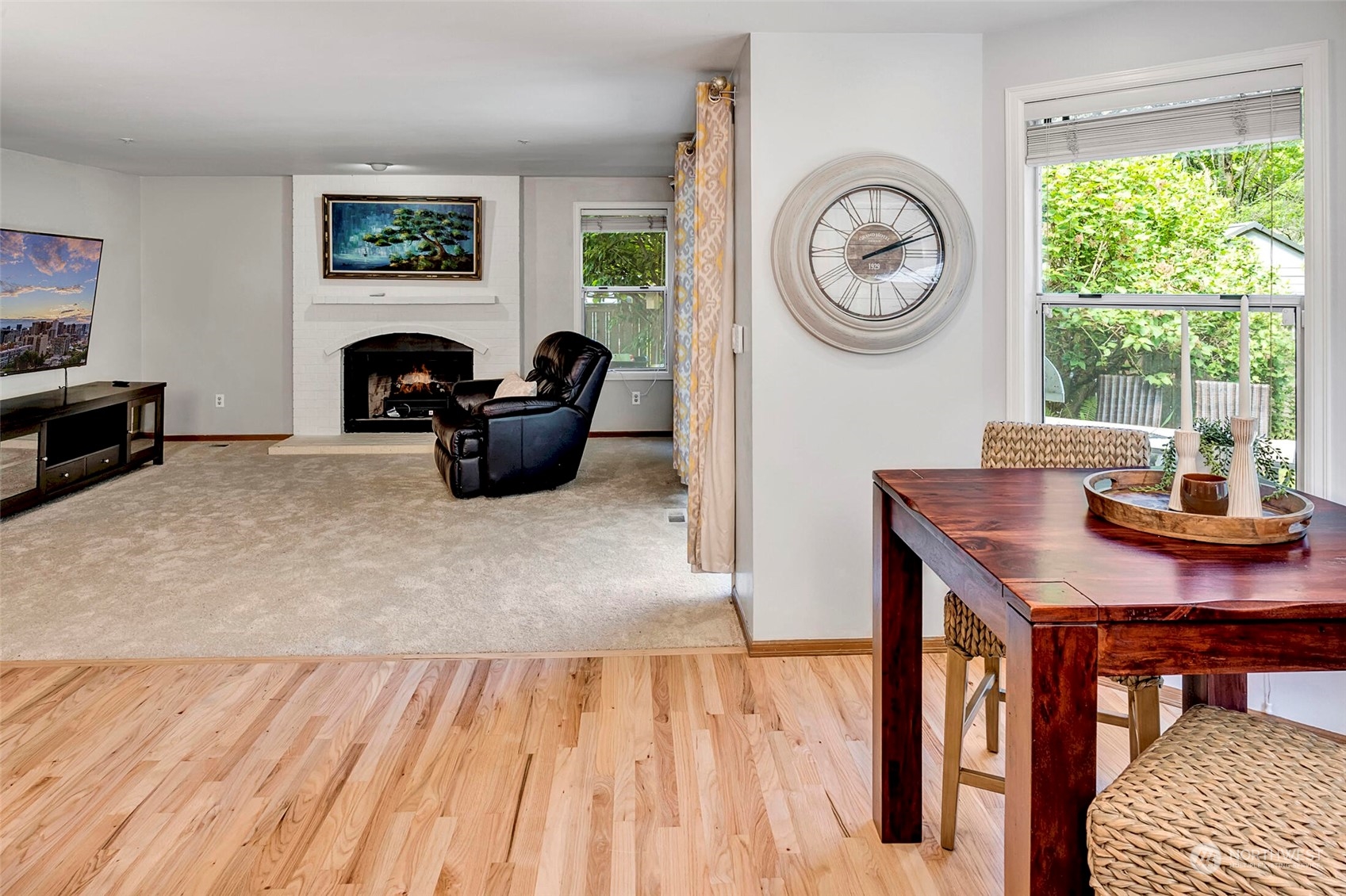 4516 Northeast 26th Court Renton, WA 98059 - Photo 10 of 28 a living room with furniture a clock and a large window