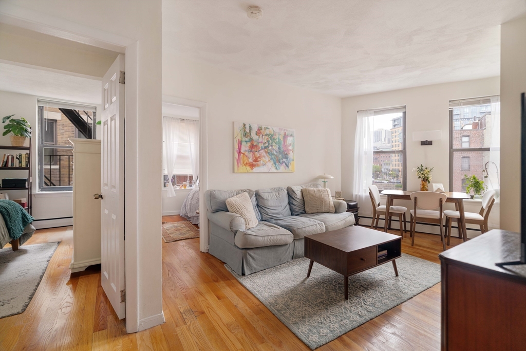 5 North Margin Street, Unit 5 Boston, MA 02113 - Photo 2 of 15 a living room with furniture a rug and a large window