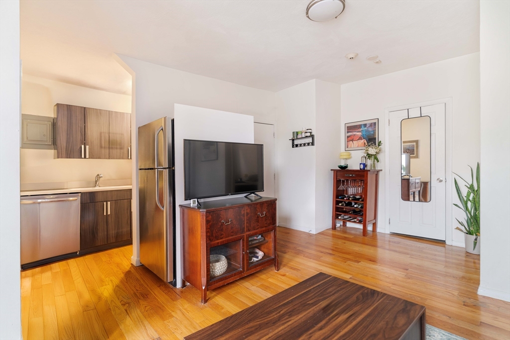 5 North Margin Street, Unit 5 Boston, MA 02113 - Photo 3 of 15 a living room with furniture and a flat screen tv