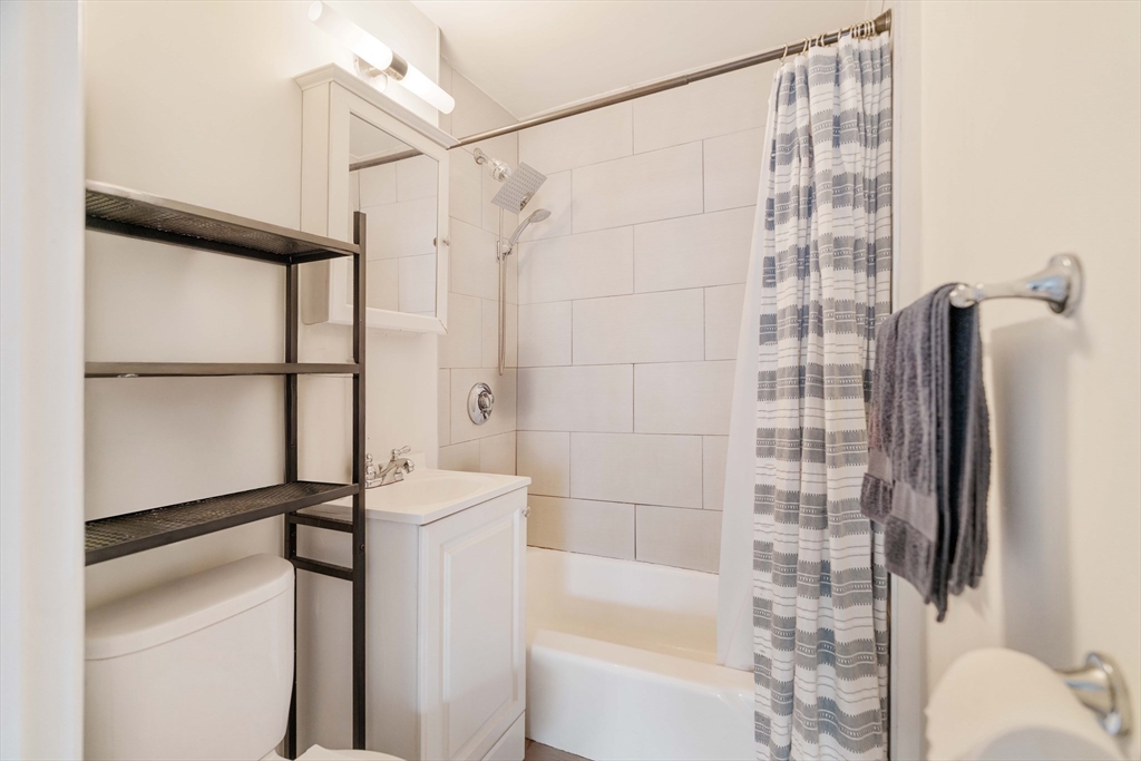 5 North Margin Street, Unit 5 Boston, MA 02113 - Photo 8 of 15 a bathroom with a shower and a toilet