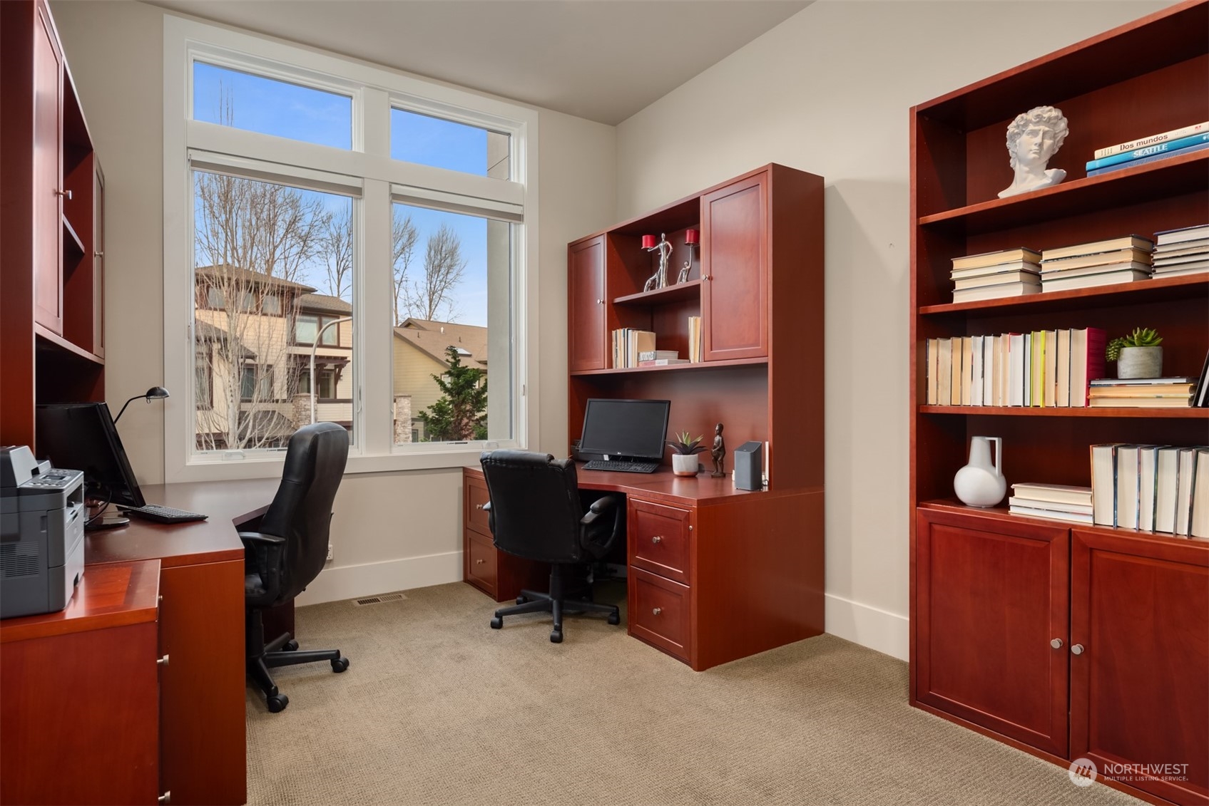 1019 North 42nd Place Renton, WA 98056 - Photo 16 of 33 a view of a workspace with bookshelf and a window