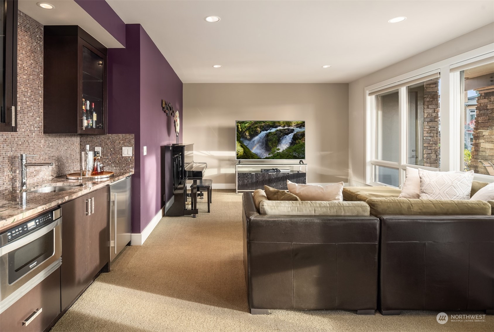 1019 North 42nd Place Renton, WA 98056 - Photo 17 of 33 a living room with furniture a flat screen tv and a refrigerator