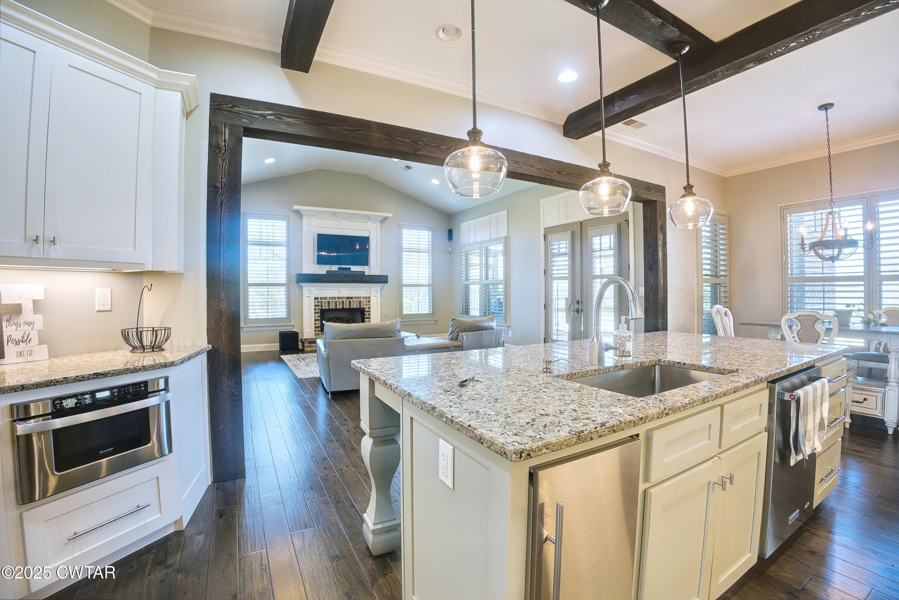 963 Ashport Road Jackson, TN 38305 - Photo 13 of 51 a kitchen with a stove and a wooden floor