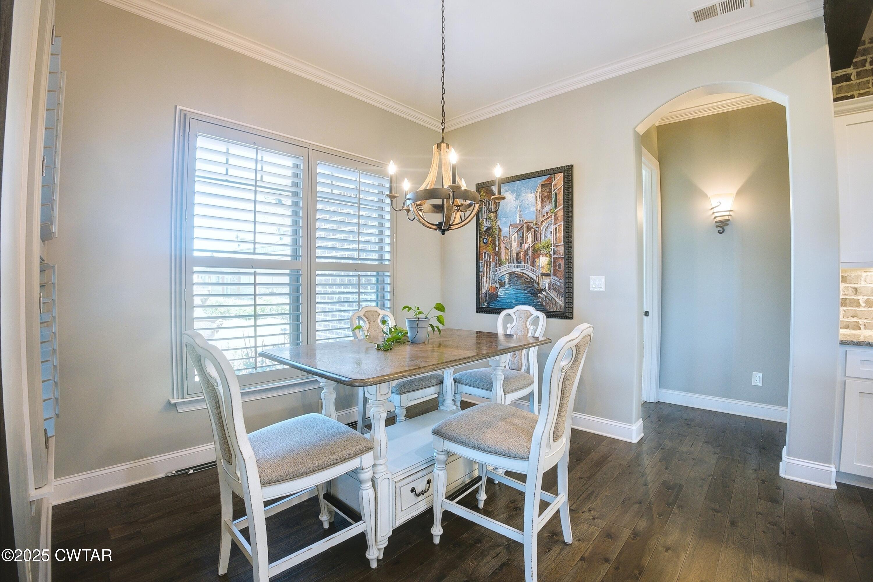 963 Ashport Road Jackson, TN 38305 - Photo 15 of 51 a view of a dining room with furniture window and wooden floor