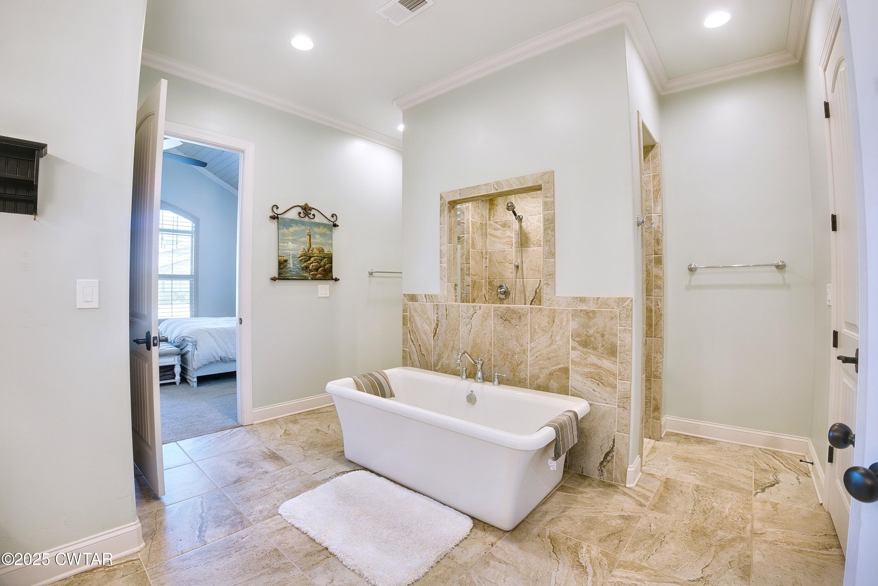 963 Ashport Road Jackson, TN 38305 - Photo 26 of 51 a spacious bathroom with a bathtub and shower