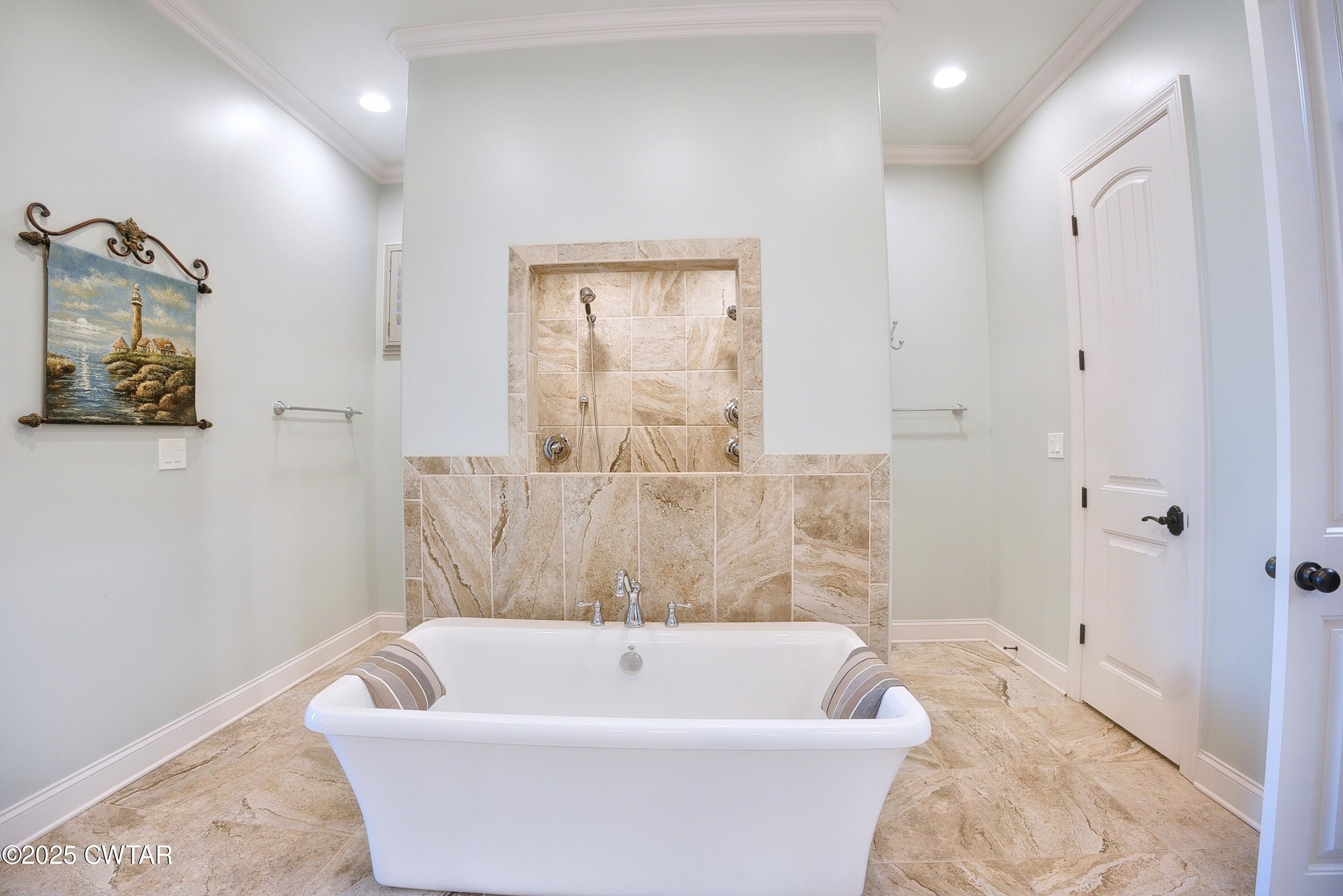 963 Ashport Road Jackson, TN 38305 - Photo 27 of 51 a bathroom with a bathtub and shower