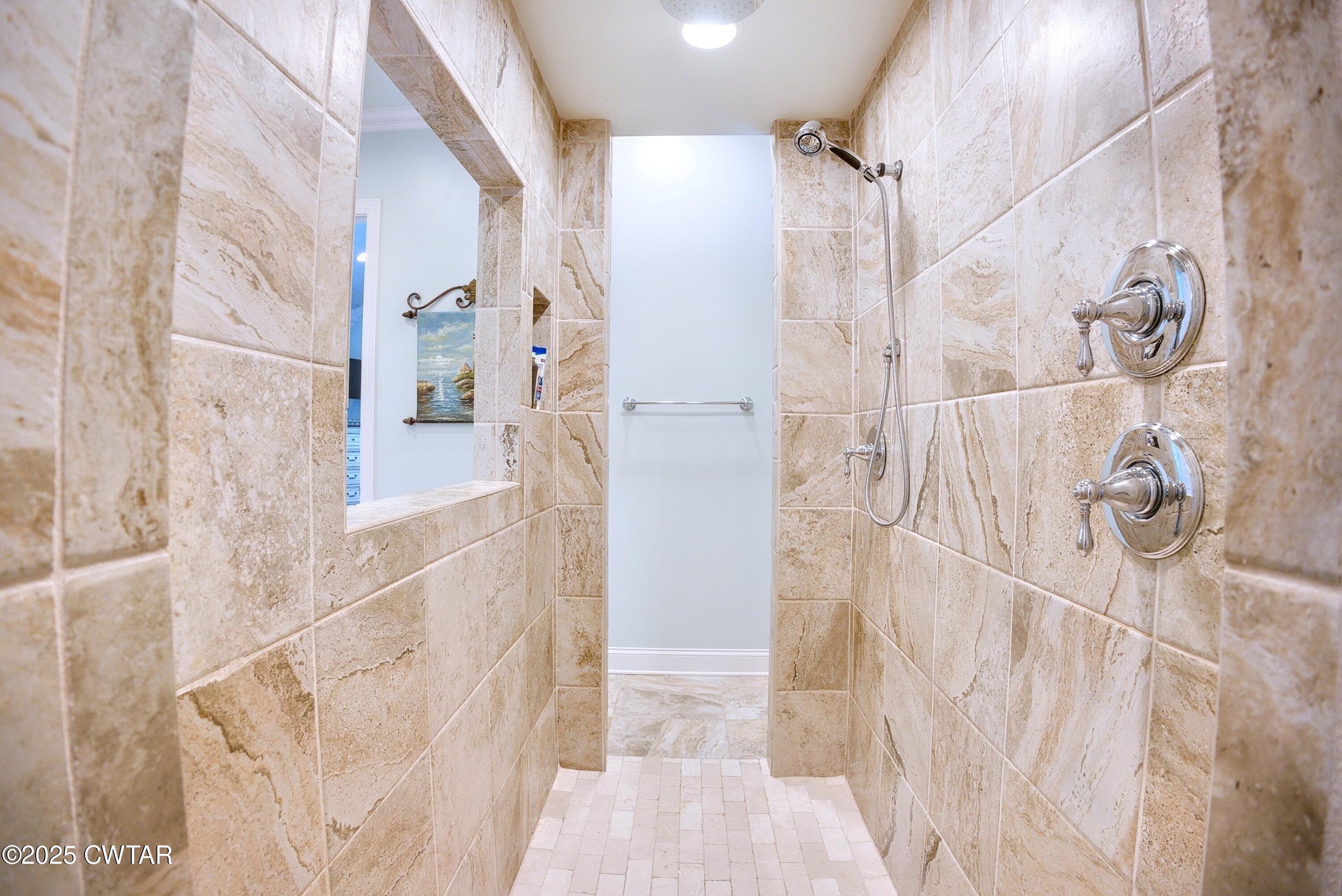 963 Ashport Road Jackson, TN 38305 - Photo 29 of 51 a bathroom with a bathtub and shower