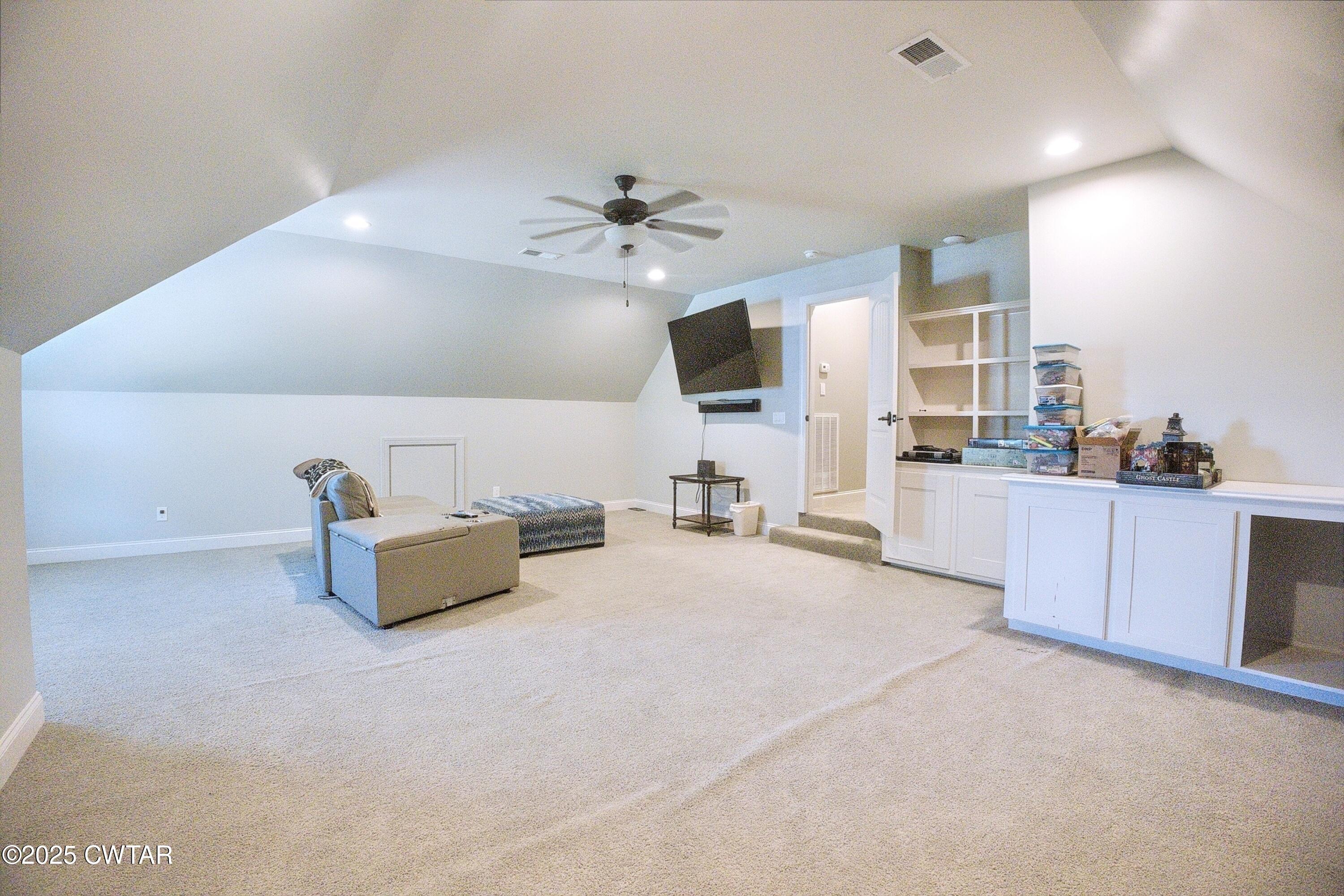 963 Ashport Road Jackson, TN 38305 - Photo 36 of 51 a living room with furniture and a flat screen tv