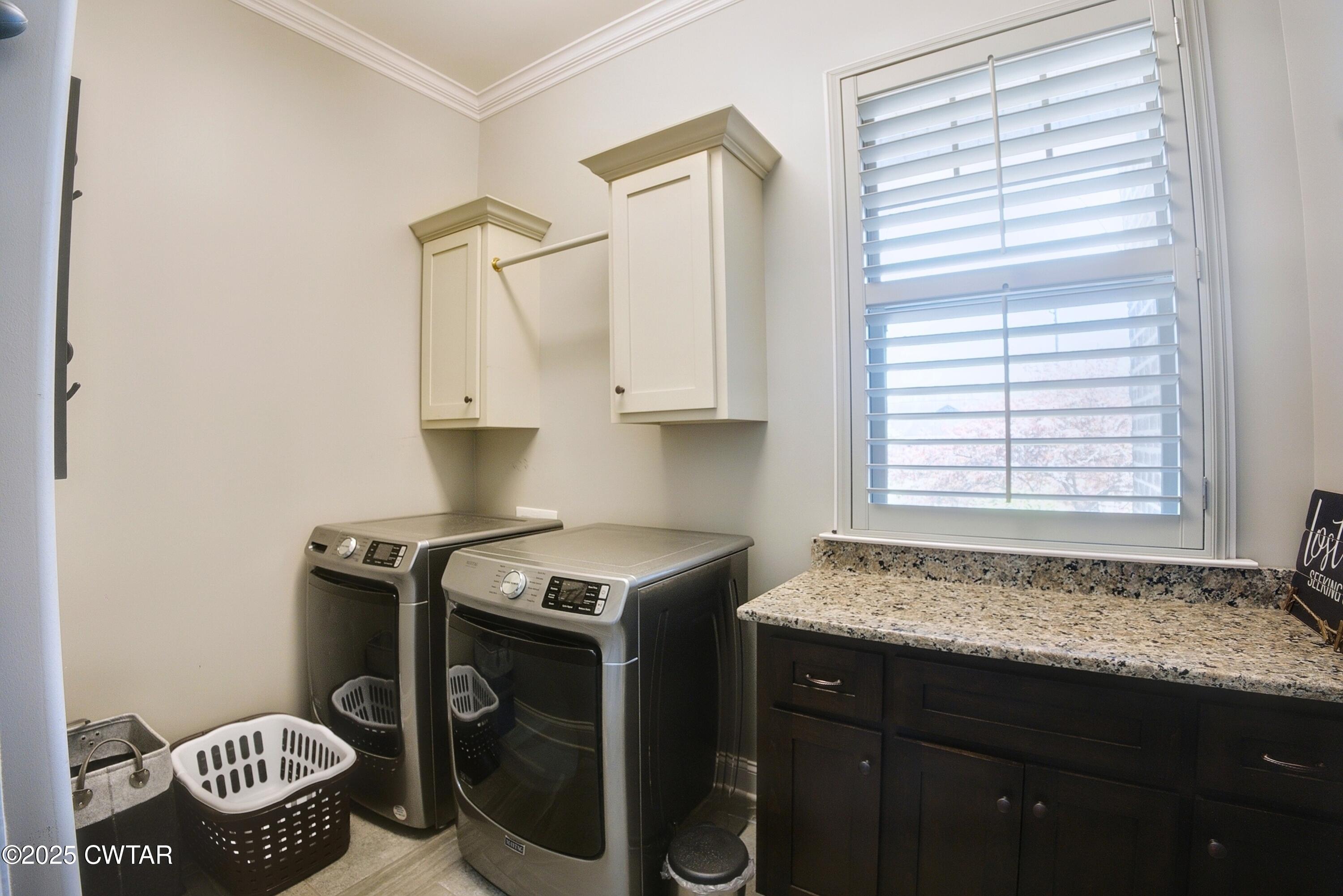 963 Ashport Road Jackson, TN 38305 - Photo 40 of 51 a kitchen with stainless steel appliances granite countertop a sink stove and cabinets