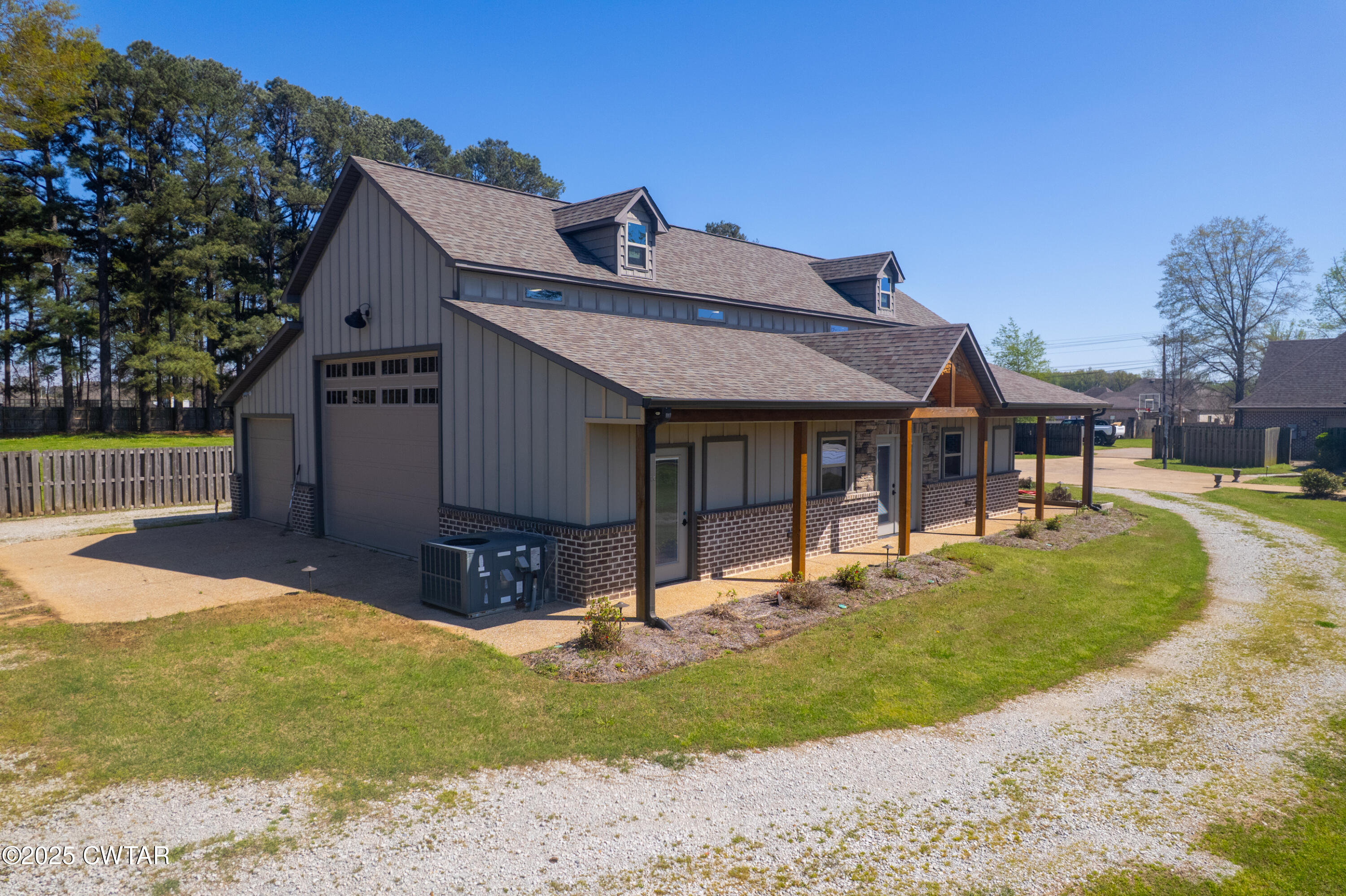 963 Ashport Road Jackson, TN 38305 - Photo 4 of 51 a view of a house with a yard patio and fire pit
