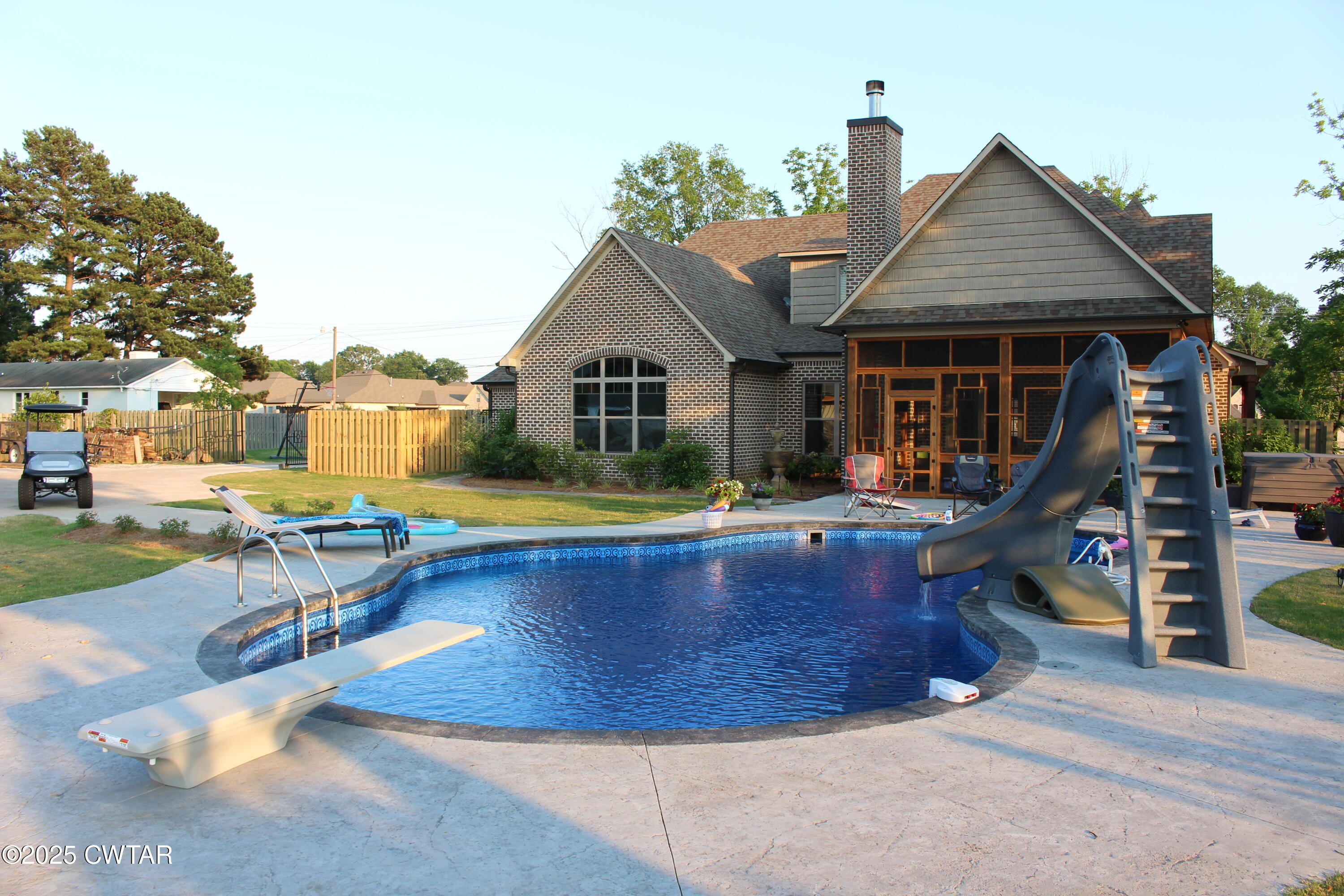 963 Ashport Road Jackson, TN 38305 - Photo 48 of 51 a view of a house with swimming pool and sitting area