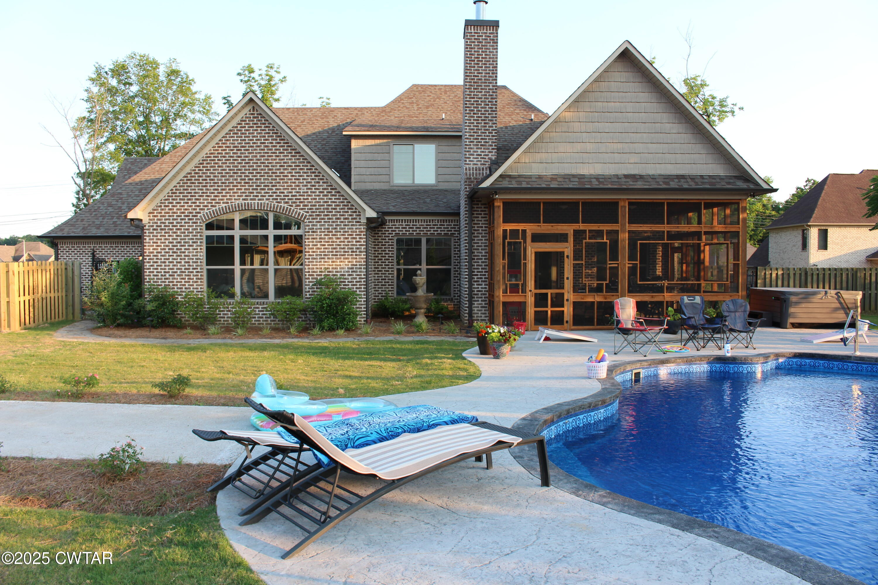 963 Ashport Road Jackson, TN 38305 - Photo 6 of 51 a view of a house with swimming pool and sitting area