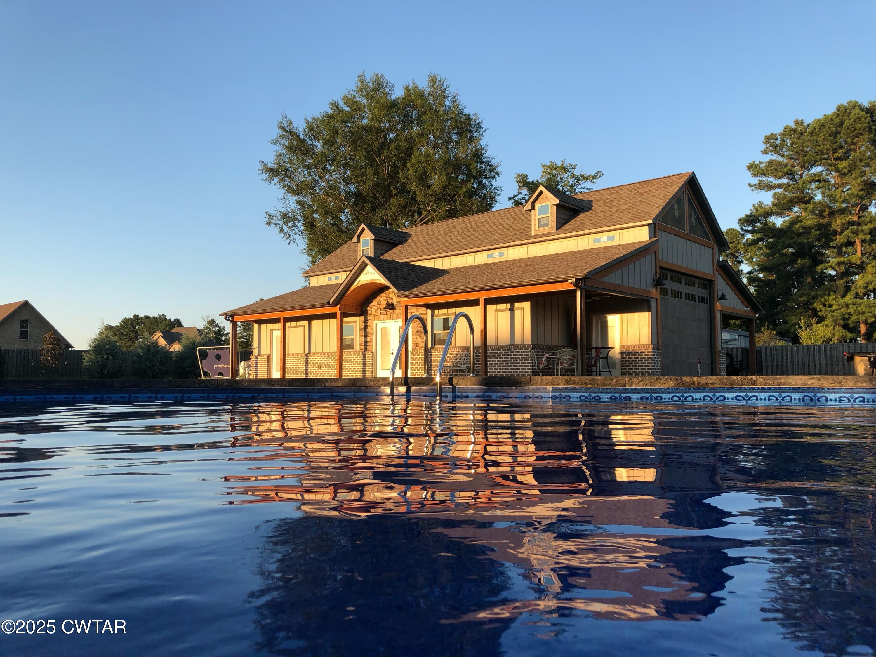 963 Ashport Road Jackson, TN 38305 - Photo 7 of 51 a front view of a house with swimming pool
