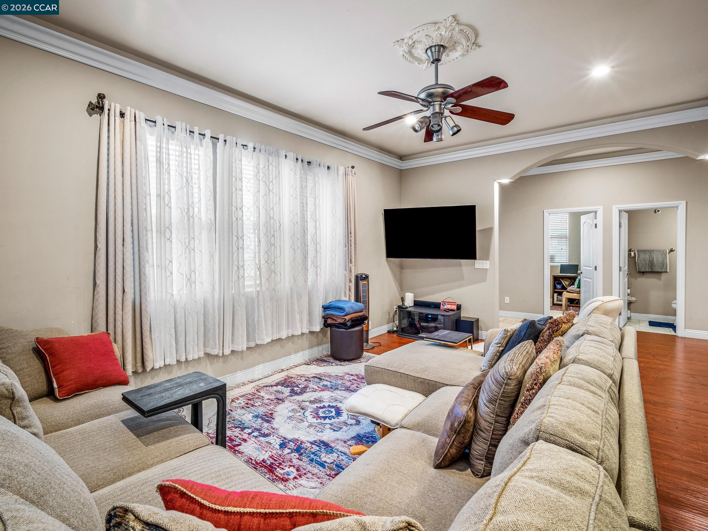 1021 Azusa Street Sacramento, CA 95833 - Photo 16 of 26 a living room with furniture a flat screen tv and a window