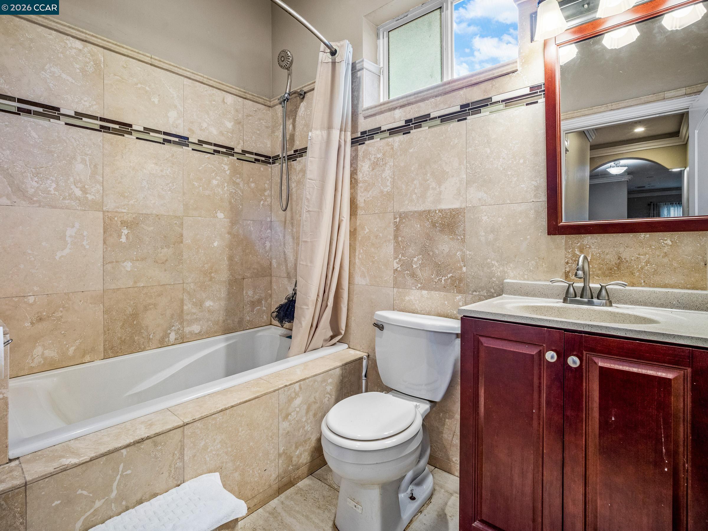 1021 Azusa Street Sacramento, CA 95833 - Photo 19 of 26 a bathroom with a sink toilet and shower