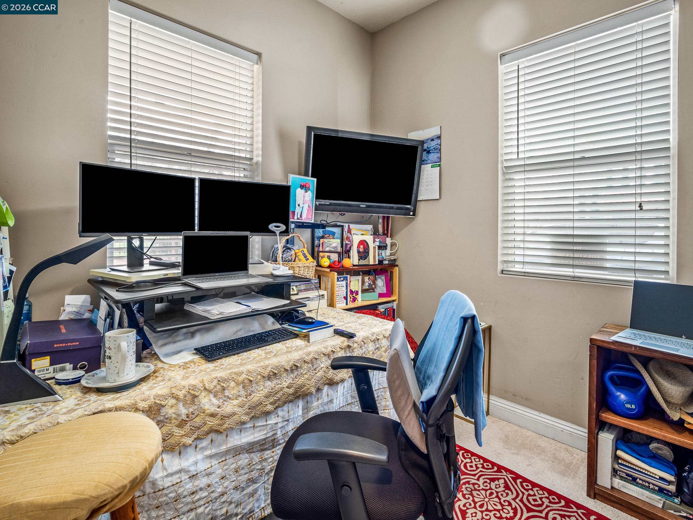 1021 Azusa Street Sacramento, CA 95833 - Photo 25 of 26 a work room with furniture a flat screen tv and a window