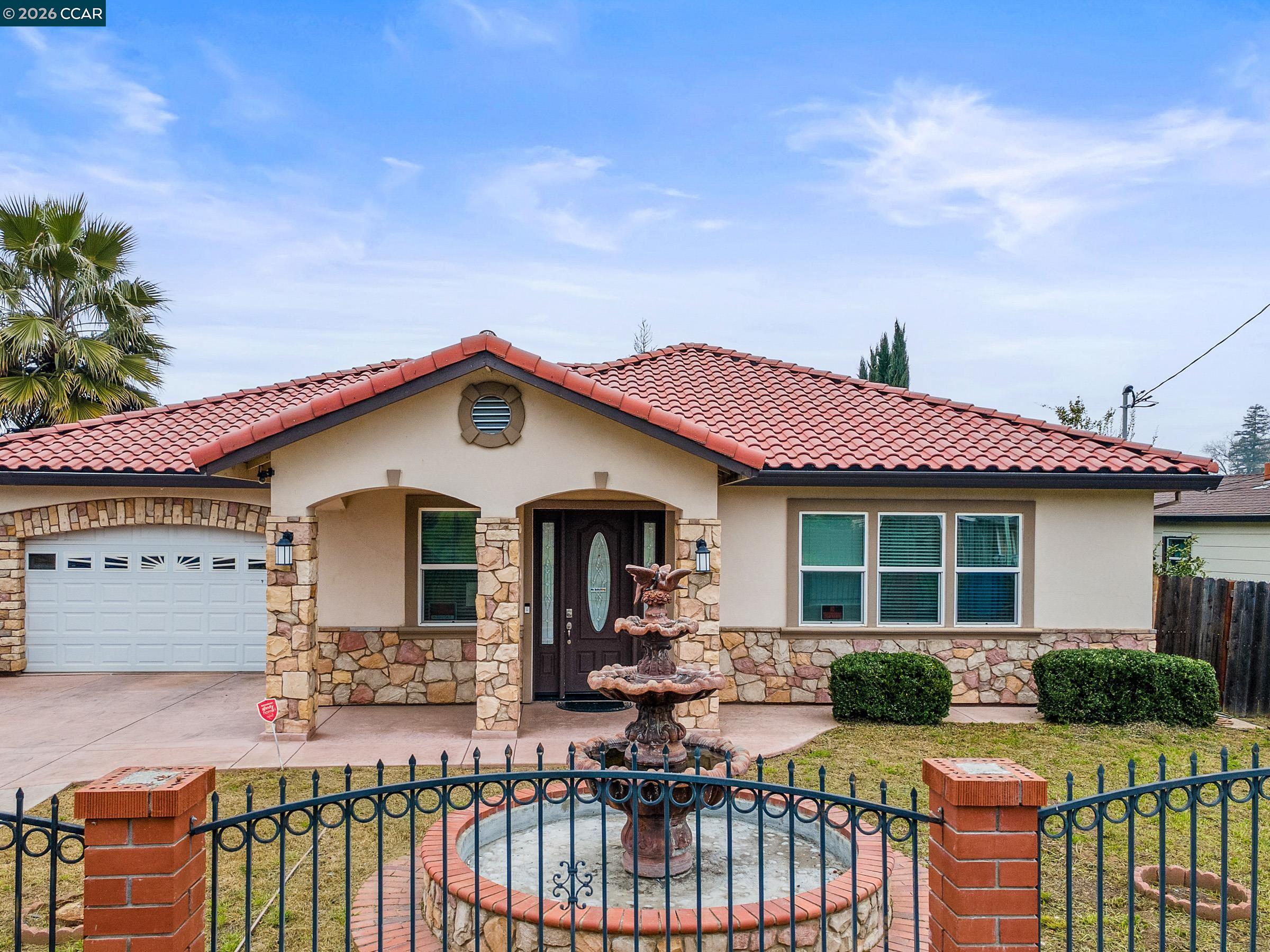 1021 Azusa Street Sacramento, CA 95833 - Photo 8 of 26 a view of a house with wooden deck and furniture