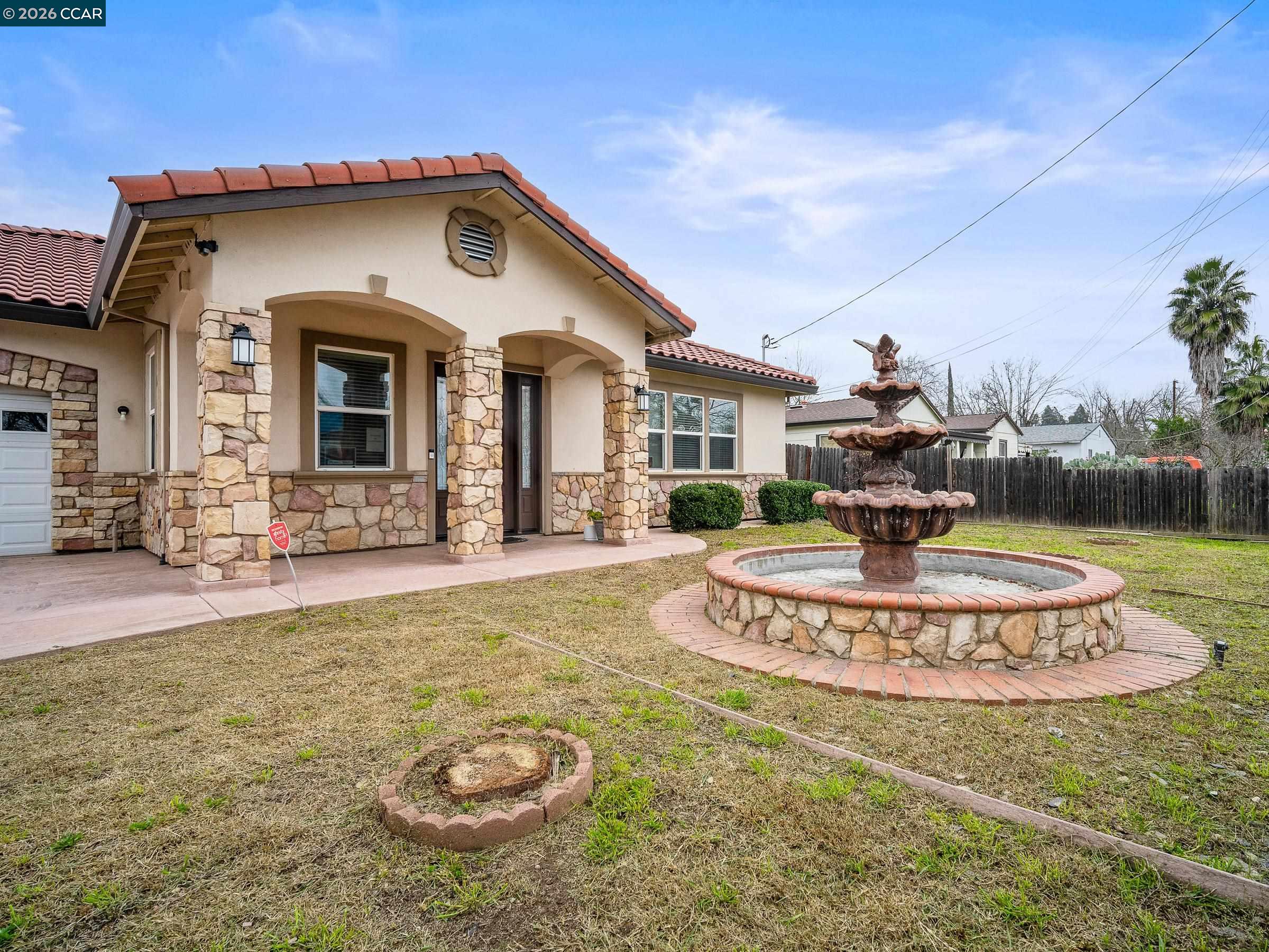 1021 Azusa Street Sacramento, CA 95833 - Photo 9 of 26 a front view of a house with a yard