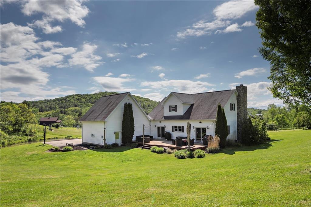 391 Bacon Run Road Clarksville, PA 15322 - Photo 3 of 25 A rear view of the home and the surrounding landscape.