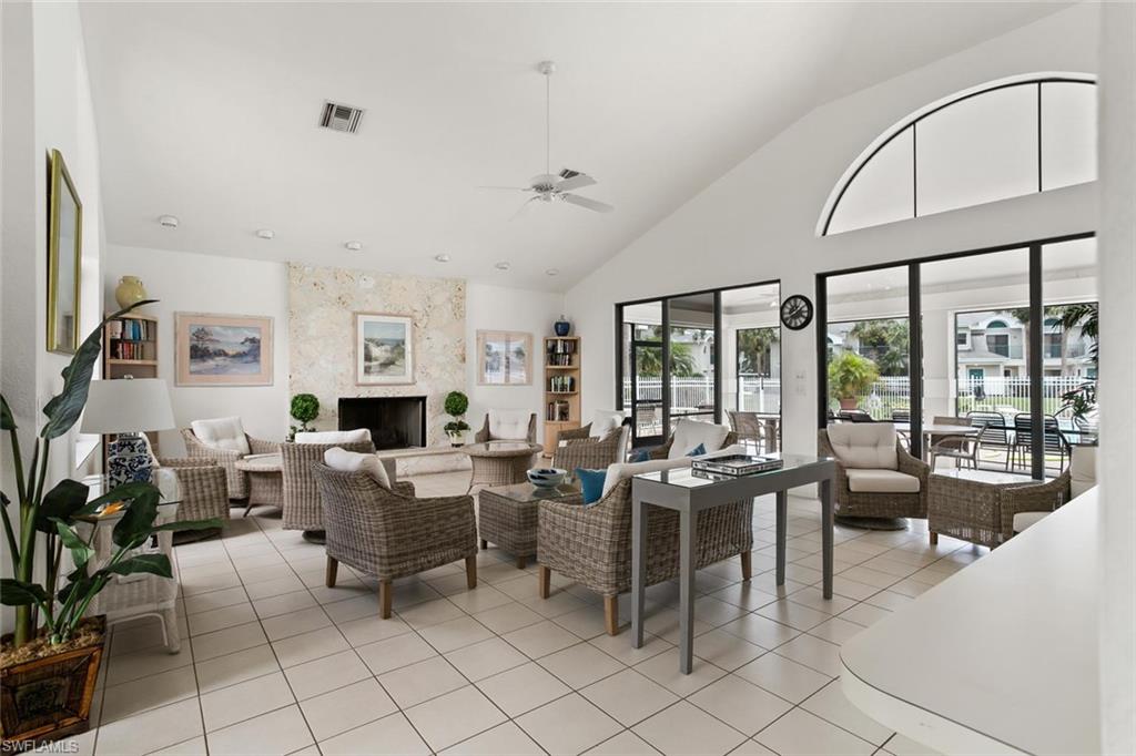81 Emerald Woods Drive, Unit M8 Naples, FL 34108 - Photo 16 of 18 a view of a livingroom with furniture window and outside view