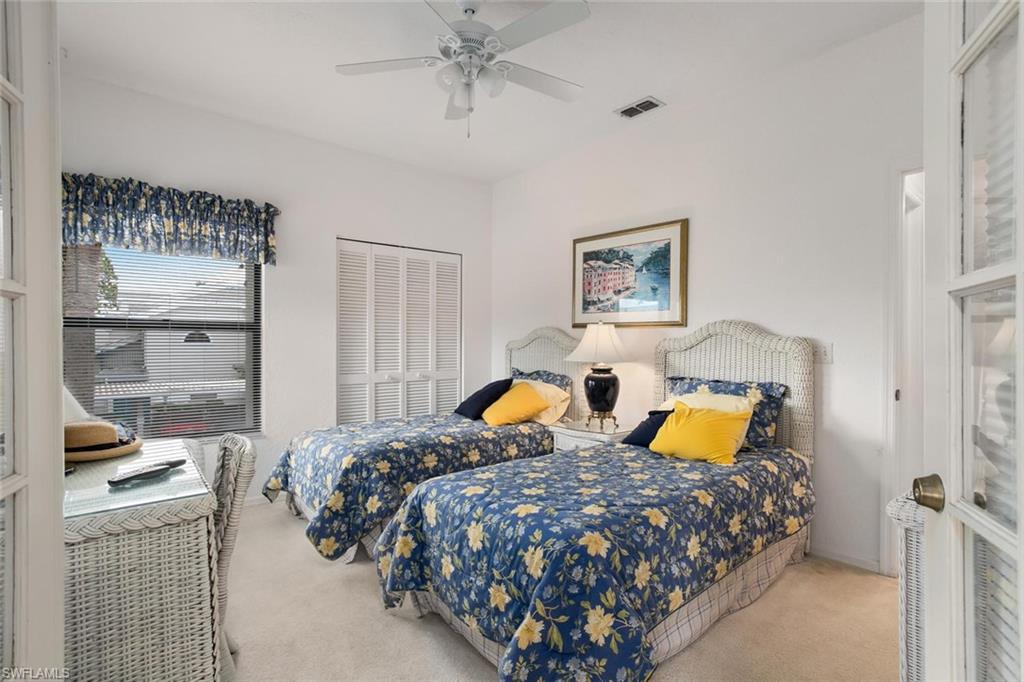81 Emerald Woods Drive, Unit M8 Naples, FL 34108 - Photo 5 of 18 a bedroom with bed and window